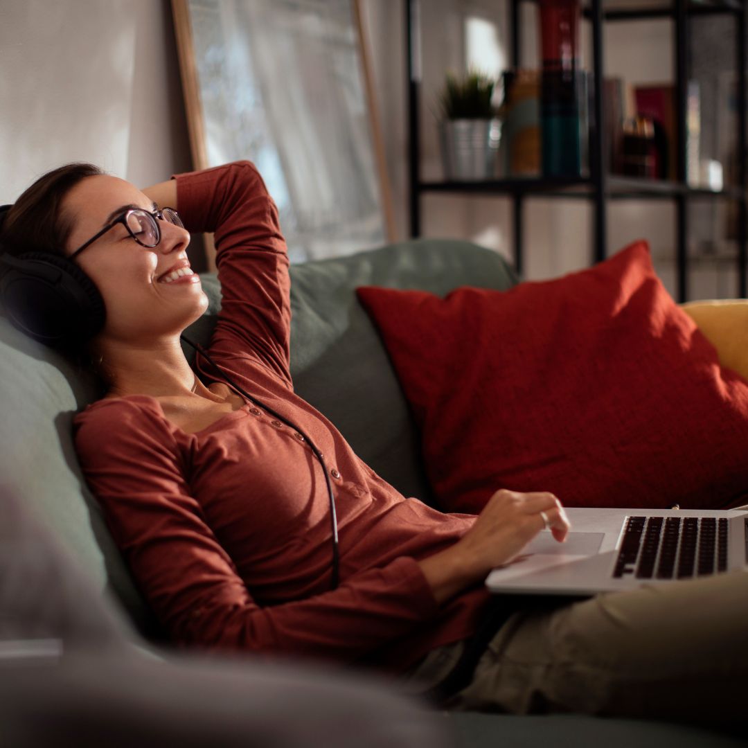 relaxed woman sitting on couch