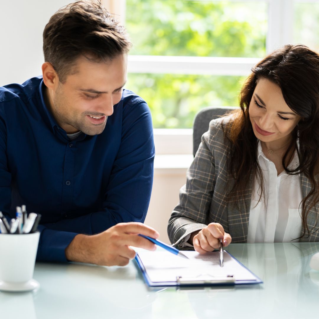 lawyer reviewing paperwork with client