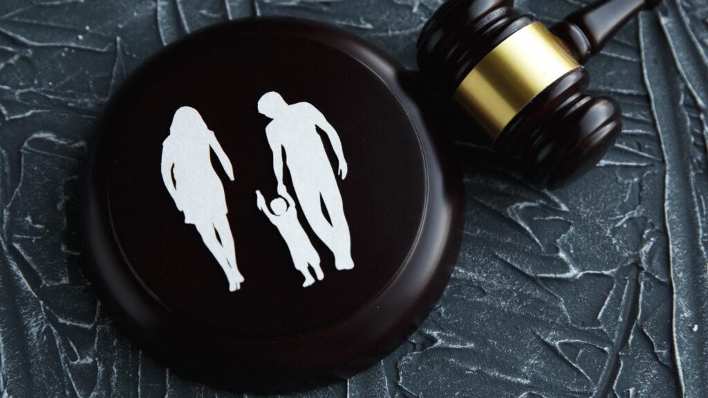 gavel with paper cutout of family