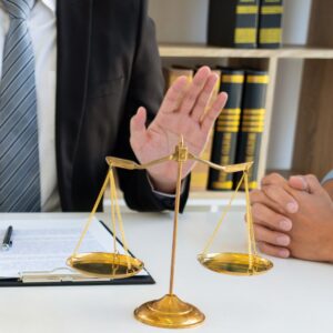 a lawyer mediating in a meeting with paperwork