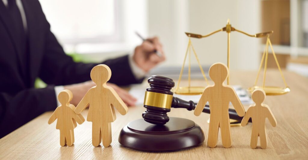 cutout family images standing on either side of a gavel