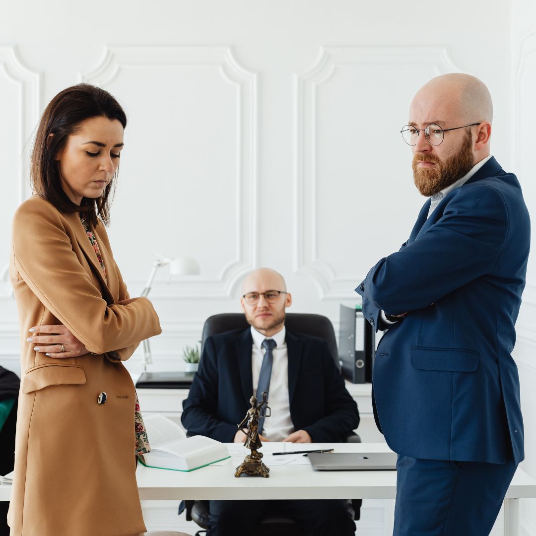 Ex-spouses meeting with divorce attorney