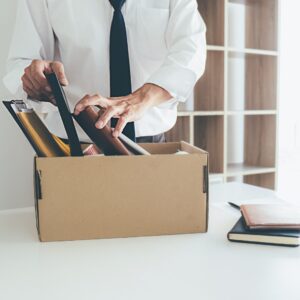 Man in a tie organizing his belongings