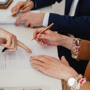 Man and woman signing papers
