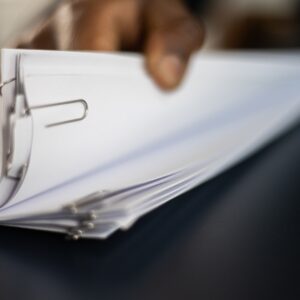 Hand thumbing through documents